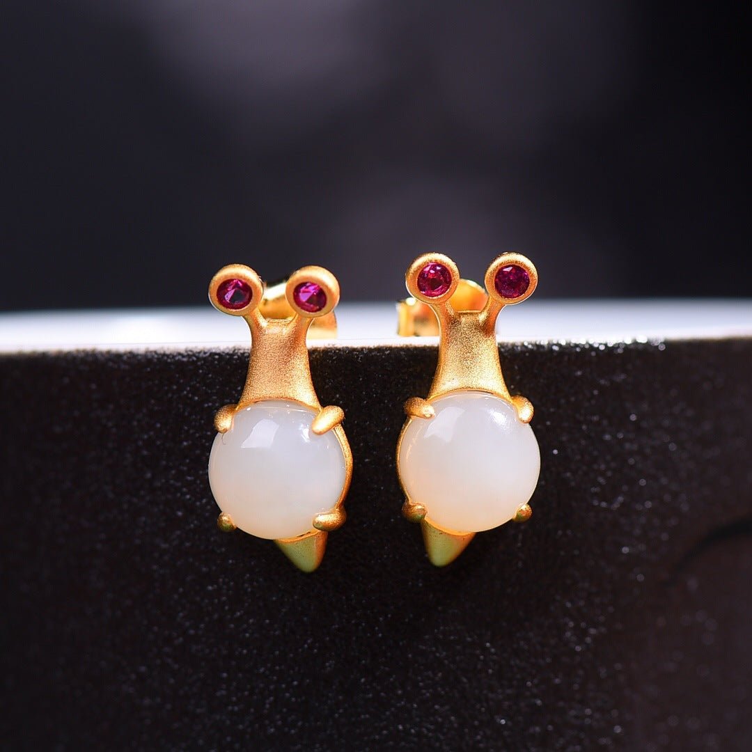 Cute minimalist mouse-shaped earrings featuring white jade bodies and whimsical gold ears, perfect for gifting.