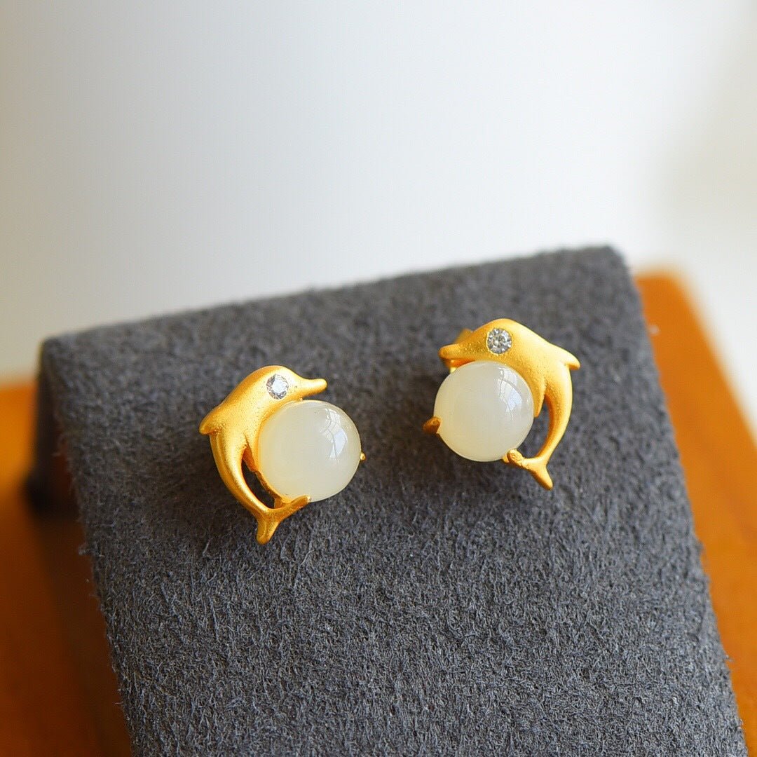 Square white jade earrings set in a bright gold tone, simple yet timeless.